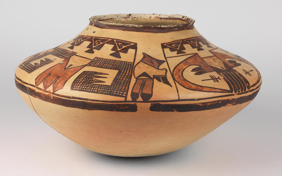 Sikyatki Polychrome ware painted with stylized bird tails, wings, terraced designs, and four crested birds.
