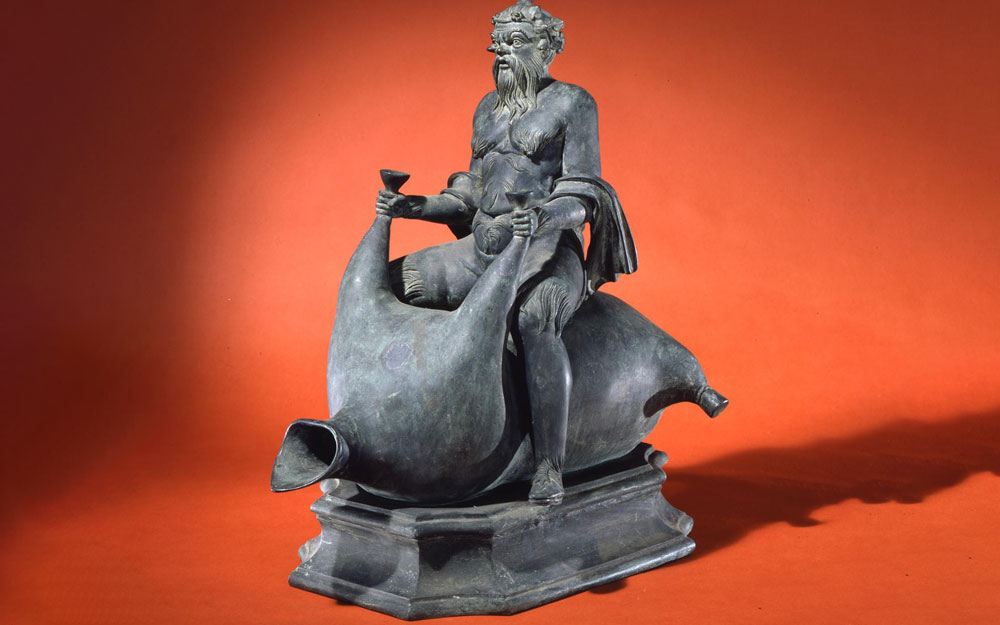 Bronze of a god riding an animal.